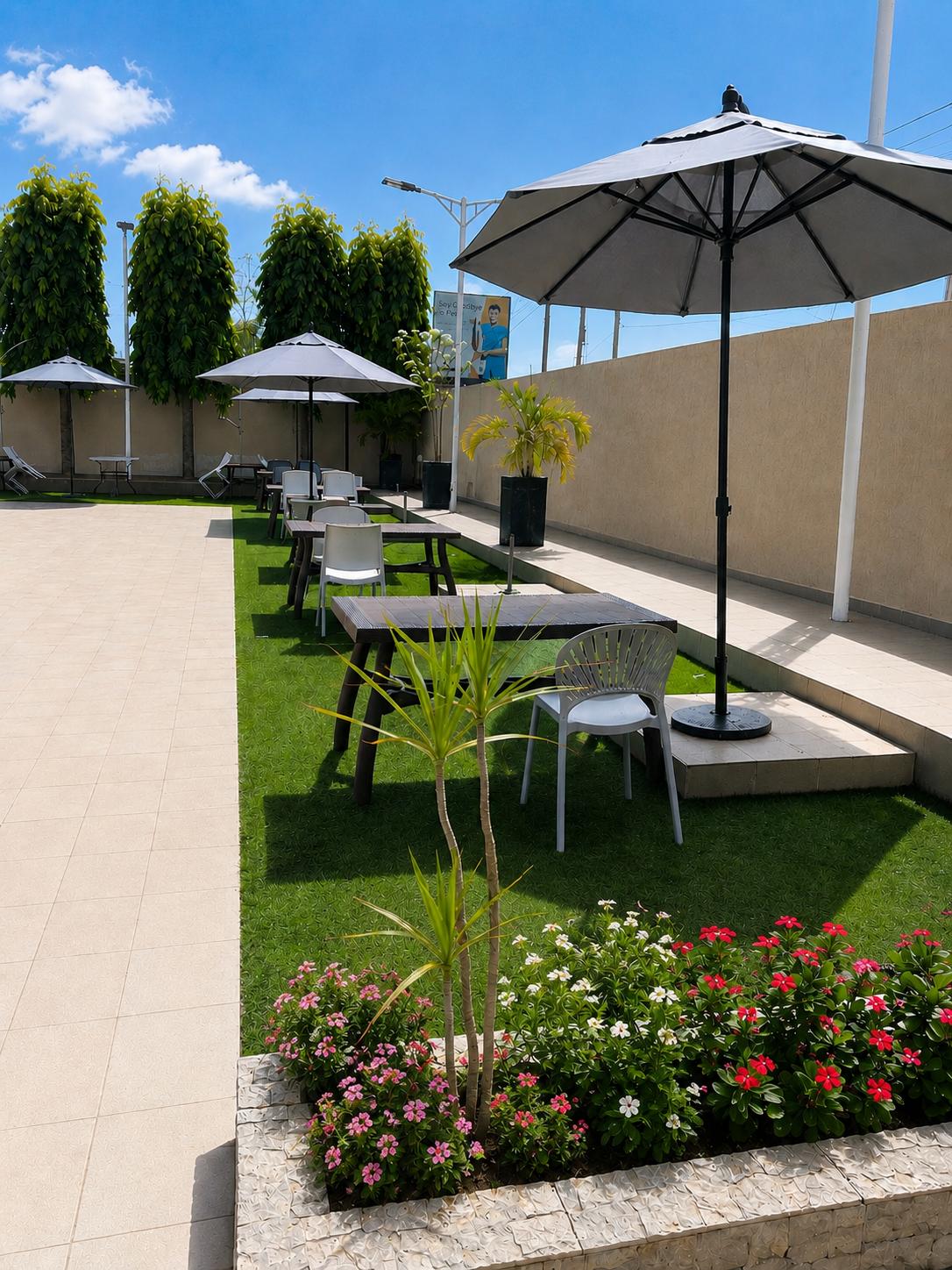 Outdoor garden dining at Relax Court Hotel Accra